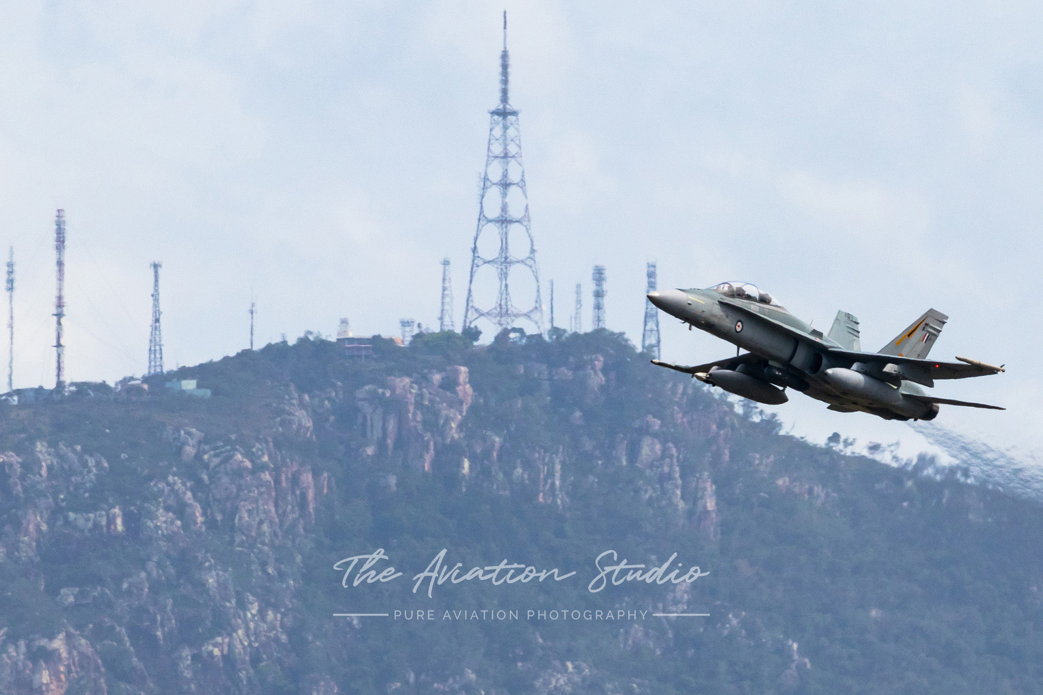 RAAF F/A-18B A21-107 departing RAAF Base Townsville with Mount Stuart in the distance