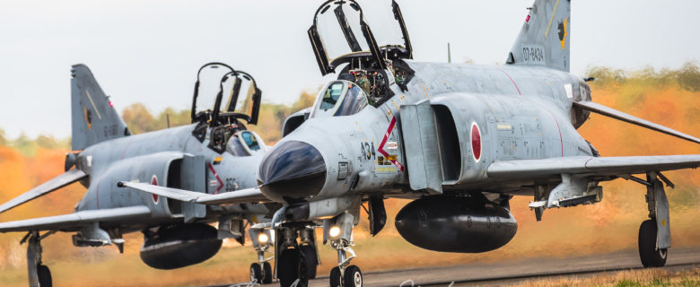 Two JASDF F-4EJ Kai's taxiing back to the display area