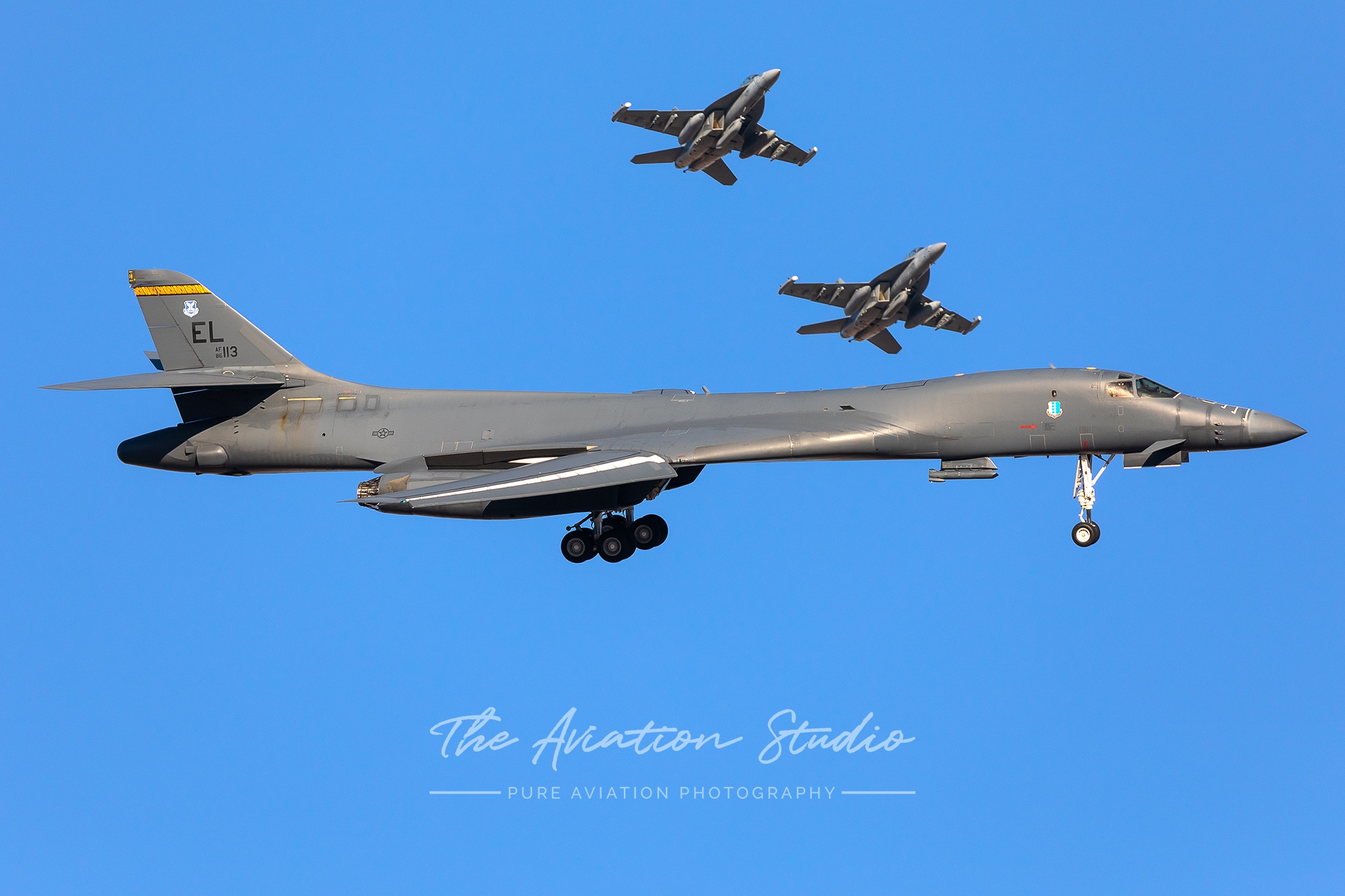United States Air Force B-1B from Ellsworth Air Force Base turns base while Navy E/A-16G's join the overhead during Red Flag 20-1