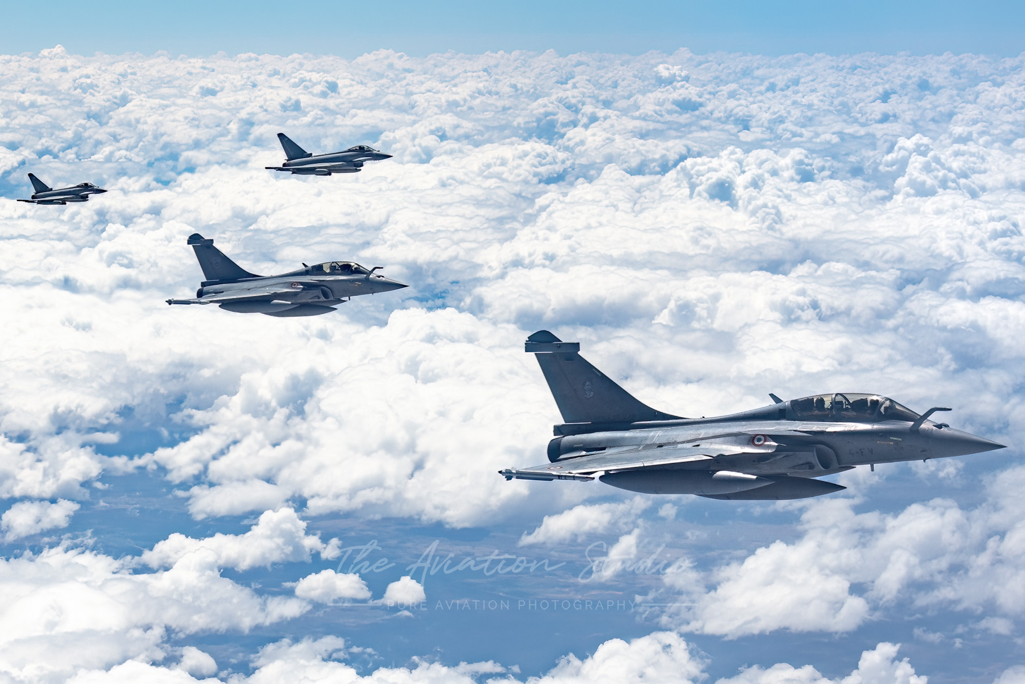French Air and Space Force Rafale B 4-FV and 4-FX in formation with Royal Air Force Eurofighter Typhoon ZK306 and ZK358 (Image: Emil Cooper)